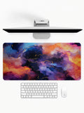 Abstract Nebula deskmat featuring colorful cosmic cloud artwork and stitched edges