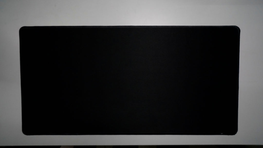 Jet Black deskmat featuring a minimalist all-black design