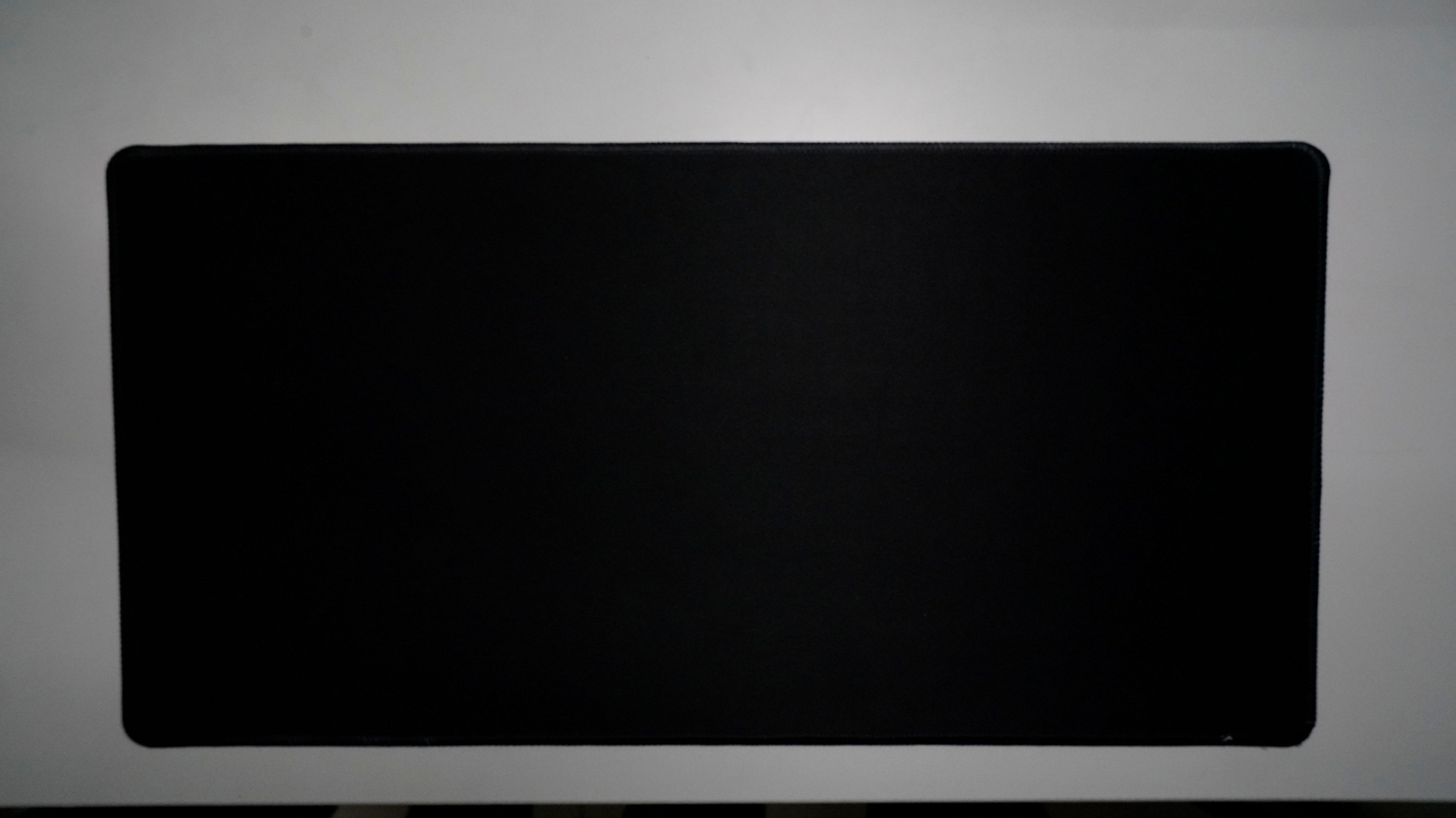 Jet Black deskmat featuring a minimalist all-black design