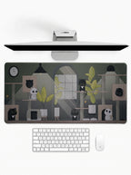 Cozy Cat Haven deskmat featuring cute cats, indoor plants, and cozy room artwork with stitched edges