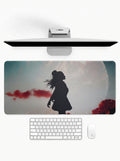 Lunar Silhouette deskmat featuring a moonlit silhouette figure with artistic landscape artwork and stitched edges