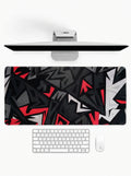 Rogue deskmat featuring abstract black, red, and white geometric design