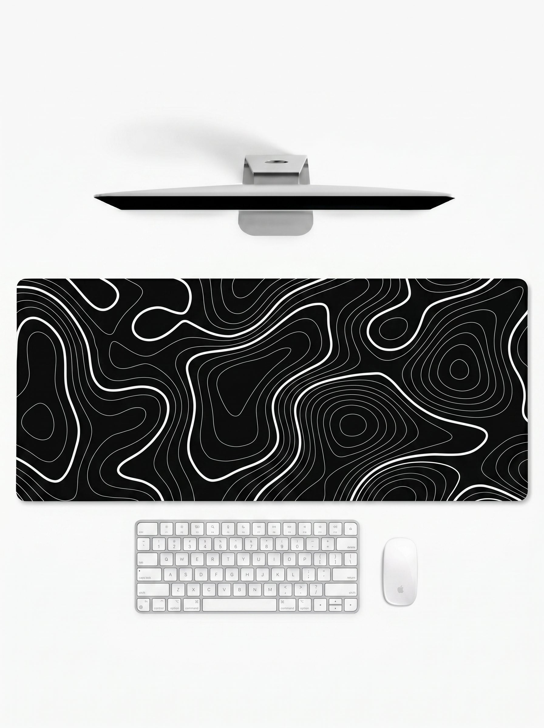 Topography XL deskmat featuring white contour lines on a black background