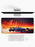 F1 car-themed desk setup with monitor, keyboard, and mouse on a white background